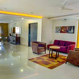 Common Room: Wide spacious common room beautifully adorned with exquisite curtains at Concord Gachibowli Serviced Apartment