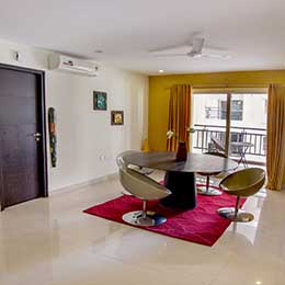 Dining Room: Roomy dining room with exquisite rugs opening in a beautiful French door at Concord Gachibowli Serviced Apartment