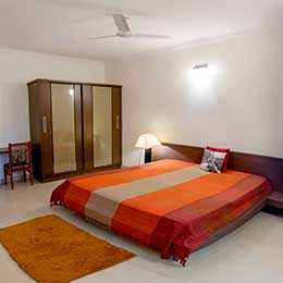 Bed Room: Snug bed amidst an open setting at Concord Gachibowli Serviced Apartment