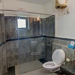 Wash-room: Clean wash-room with a shower enclosure and fitted with expensive sanitary wares at Concord Casablanca Serviced Apartment